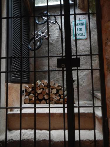a pile of fire wood in a cage at Ca' de Pria in Borgio Verezzi