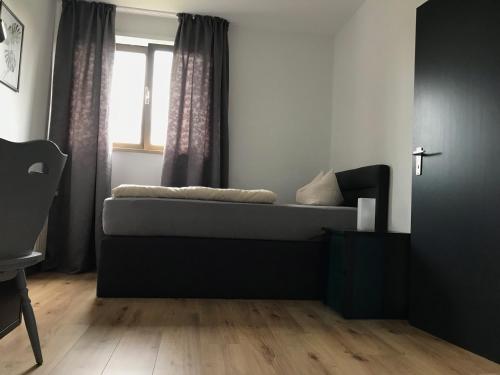 a living room with a couch and a window at Best Apartments in Bad Salzuflen
