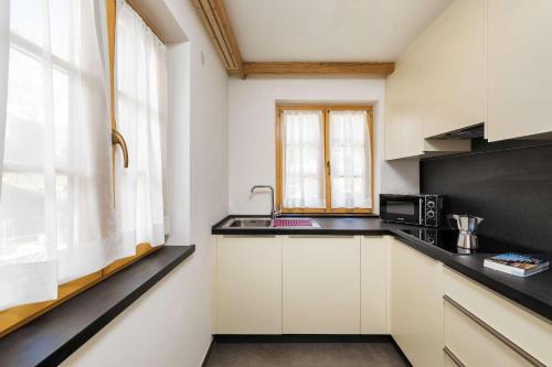 Una cocina o zona de cocina en Residence Rottonara