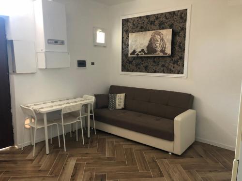 a living room with a couch and a table at Camaldoli House in Milan