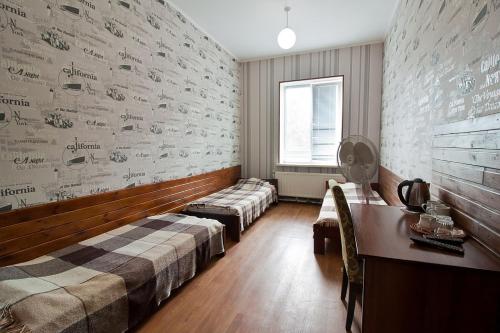 Ένα ή περισσότερα κρεβάτια σε δωμάτιο στο Tsentr Hostel