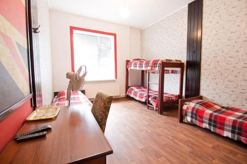 Ένα ή περισσότερα κρεβάτια σε δωμάτιο στο Tsentr Hostel