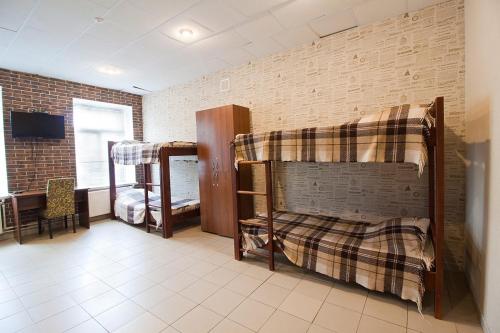 Ένα ή περισσότερα κρεβάτια σε δωμάτιο στο Tsentr Hostel