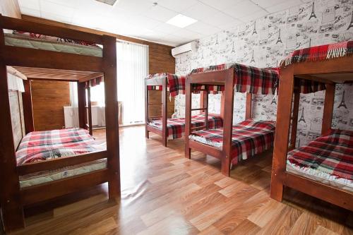 a group of four bunk beds in a room at Tsentr Hostel in Vinnytsya