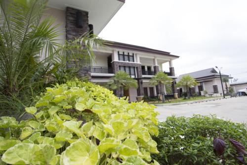 a house with a garden of lettuce in front of it at Fortune Surin Hotel in Surin