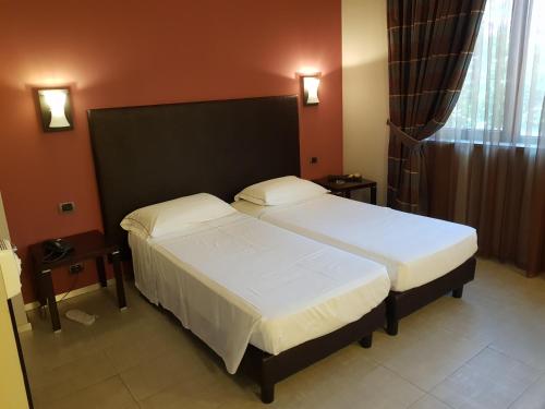 Säng eller sängar i ett rum på Hotel Montini Linate Airport