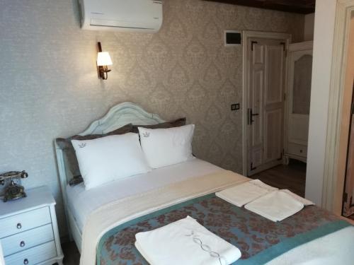 Celsus Boutique Hotelにあるベッド