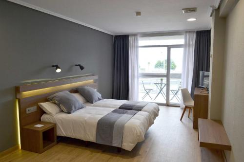 Voodi või voodid majutusasutuse Hotel Alda Sada Marina toas