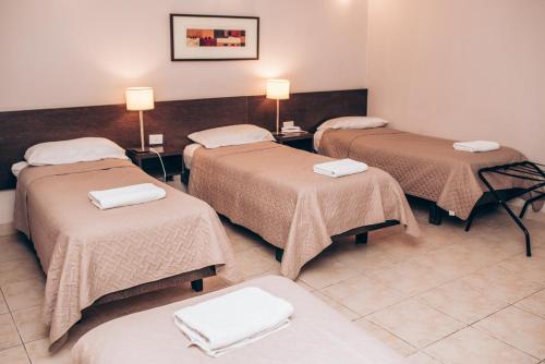 Postel nebo postele na pokoji v ubytování Hotel Solano