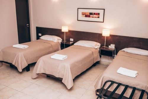 Postel nebo postele na pokoji v ubytování Hotel Solano