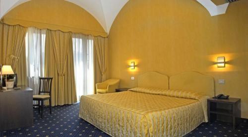 Ένα ή περισσότερα κρεβάτια σε δωμάτιο στο Albergo della Torre dal 1891