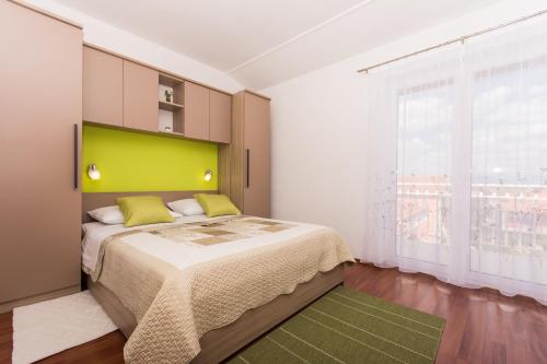 מיטה או מיטות בחדר ב-Apartments Barba