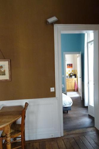 a room with a door leading to a bedroom at Le Quatre in Rennes