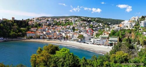 a city on a hill with a beach and buildings at Laz Palace in Ulcinj