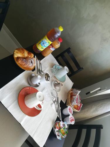 a table with food and drinks on top of it at Guest House Domus Cicerone in Formia