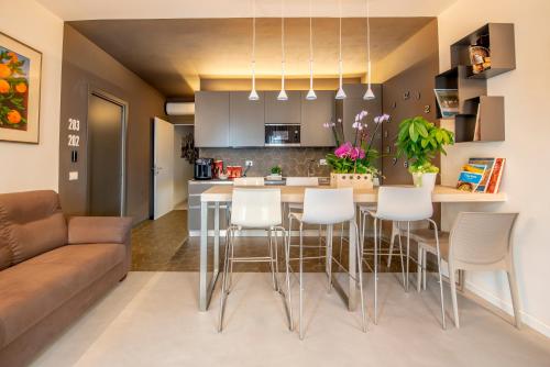 a kitchen and living room with a table and chairs at Casa Ercoli B&B in Vinci