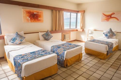 Cama ou camas em um quarto em Hotel Dan Inn Mar Piedade - Grande Recife By Nacional Inn