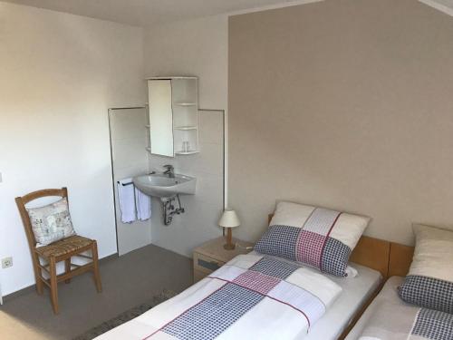 Postel nebo postele na pokoji v ubytování Haus Mittelberg