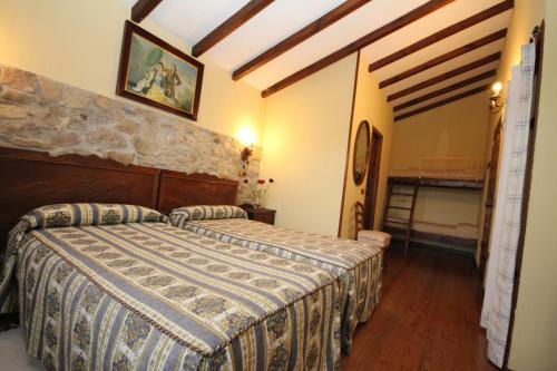 a bedroom with a large bed in a room at La Llosa in Villaviciosa