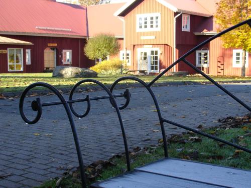 a metal gate in front of a building at Två Skyttlar in Örby
