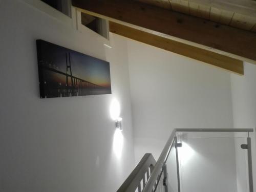 a picture of a bridge hanging on a wall at La Califfa in Vietri sul Mare