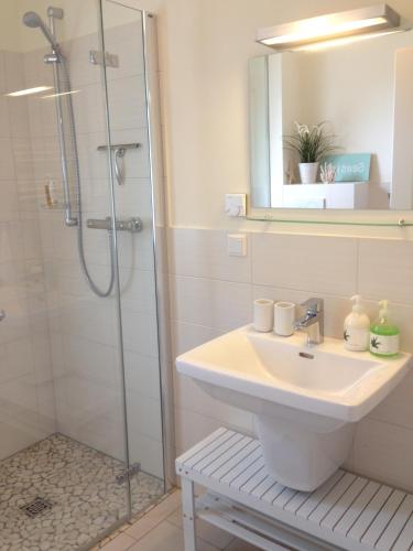 a bathroom with a sink and a shower at Beach Home in Böhl