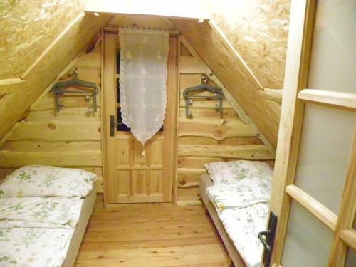 Krevet ili kreveti na sprat u jedinici u okviru objekta Dom Letniskowy Ostaszewo