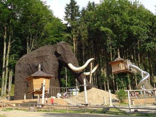 a statue of an elephant in a park at Apartmány Sport Dolní Morava in Dolní Morava