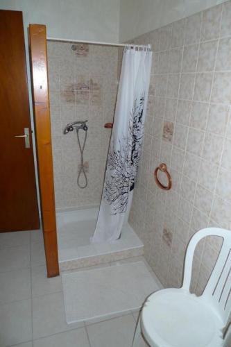 a bathroom with a shower with a toilet and a sink at Chambres d'Hôtes Mazurier in Cozes