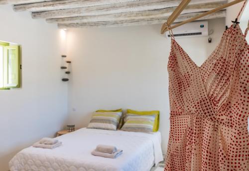 Ένα ή περισσότερα κρεβάτια σε δωμάτιο στο Casa Filakopi