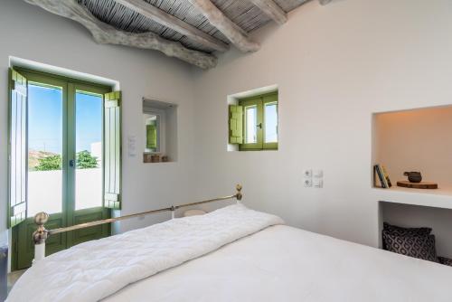 Ένα ή περισσότερα κρεβάτια σε δωμάτιο στο Casa Filakopi
