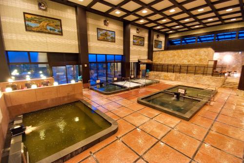 a large room with two pools of water at Nara Plaza Hotel in Tenri