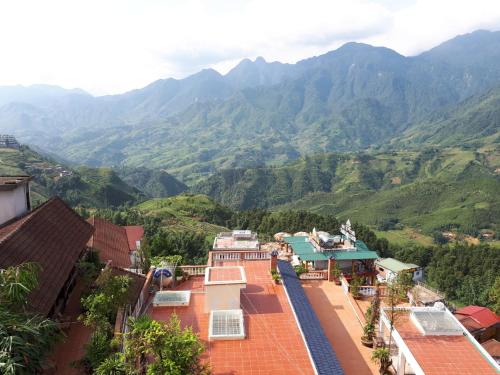 a view of the mountains from the roofs of houses at Cat Cat View Hotel in Sa Pa