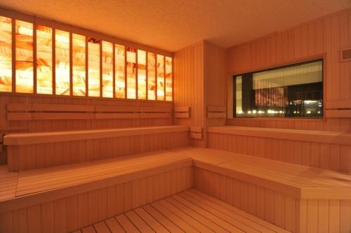 a sauna with wooden benches and a window at Nara Plaza Hotel in Tenri