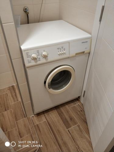 a washer and dryer in a small room at Apartments Nogic in Peroj