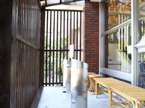 a patio with a wooden table and a bench at Lakeland Hotel Mizunosato in Fujikawaguchiko