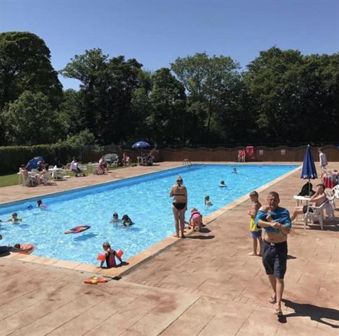 a group of people in a swimming pool at 89 Lower Lakeside - Glan Gwna Holiday Park in Caernarfon