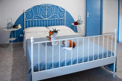 Postel nebo postele na pokoji v ubytování L' Arena Suite - Sicilian style 140 mq flat with balcony and Arena seeview