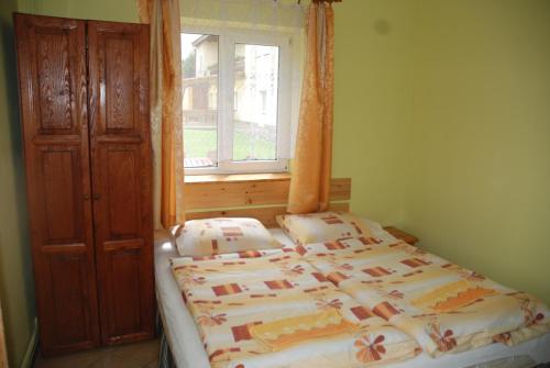 Katil atau katil-katil dalam bilik di Apartamenty pod Werchowyną