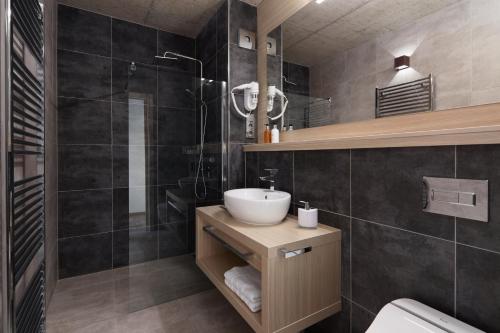 Koupelna v ubytování JBX Resort Apartments Lipno