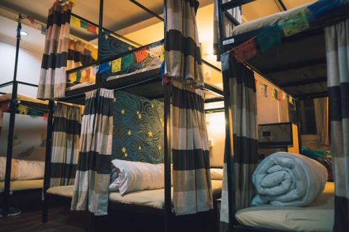 a room with two bunk beds in a room at Wander Thirst in Kathmandu