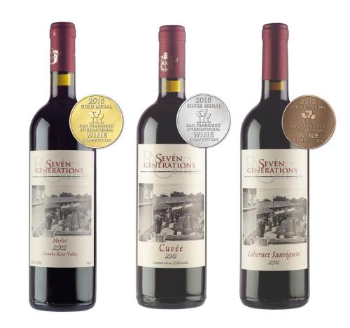 three bottles of red wine with labels on them at Seven Generations Winery Hotel in Mechka
