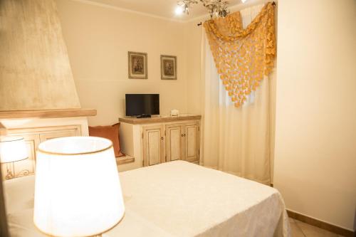 Postel nebo postele na pokoji v ubytování Agriturismo Colle Mura