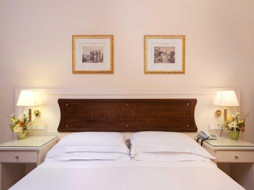 En eller flere senge i et værelse på Residenza Domiziano