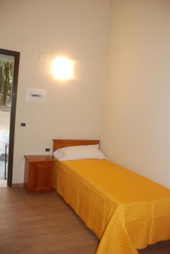 En eller flere senger på et rom på Hotel Bosco Selene