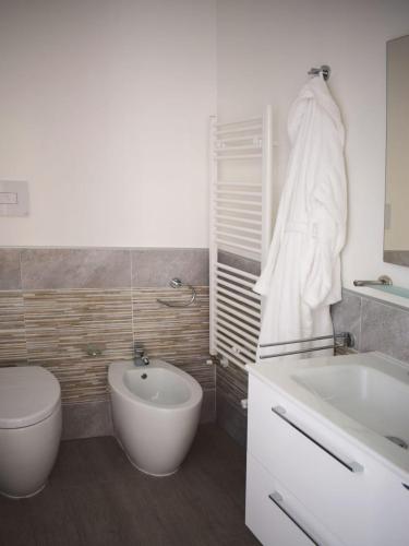 a bathroom with a toilet and a sink and a tub at Il Borgo in Paola
