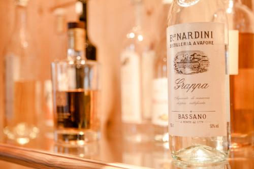 a bottle of wine sitting on top of a table at Schlosshotel Grünwald in Grünwald