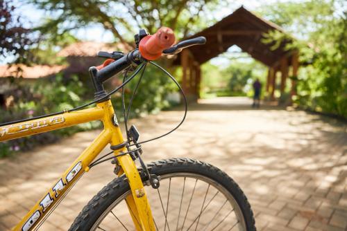 a yellow bike parked in front of a bridge at Sagana Getaway Resort in Maranjua