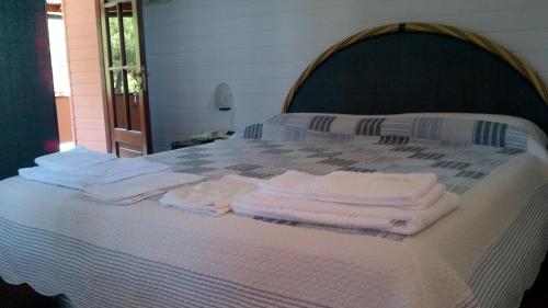 Кровать или кровати в номере Hotel Fiascherino