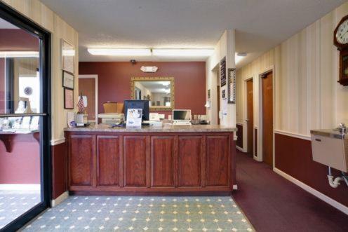 a lobby with a reception desk in a hospital at America's Best Value Inn-Athens in Athens